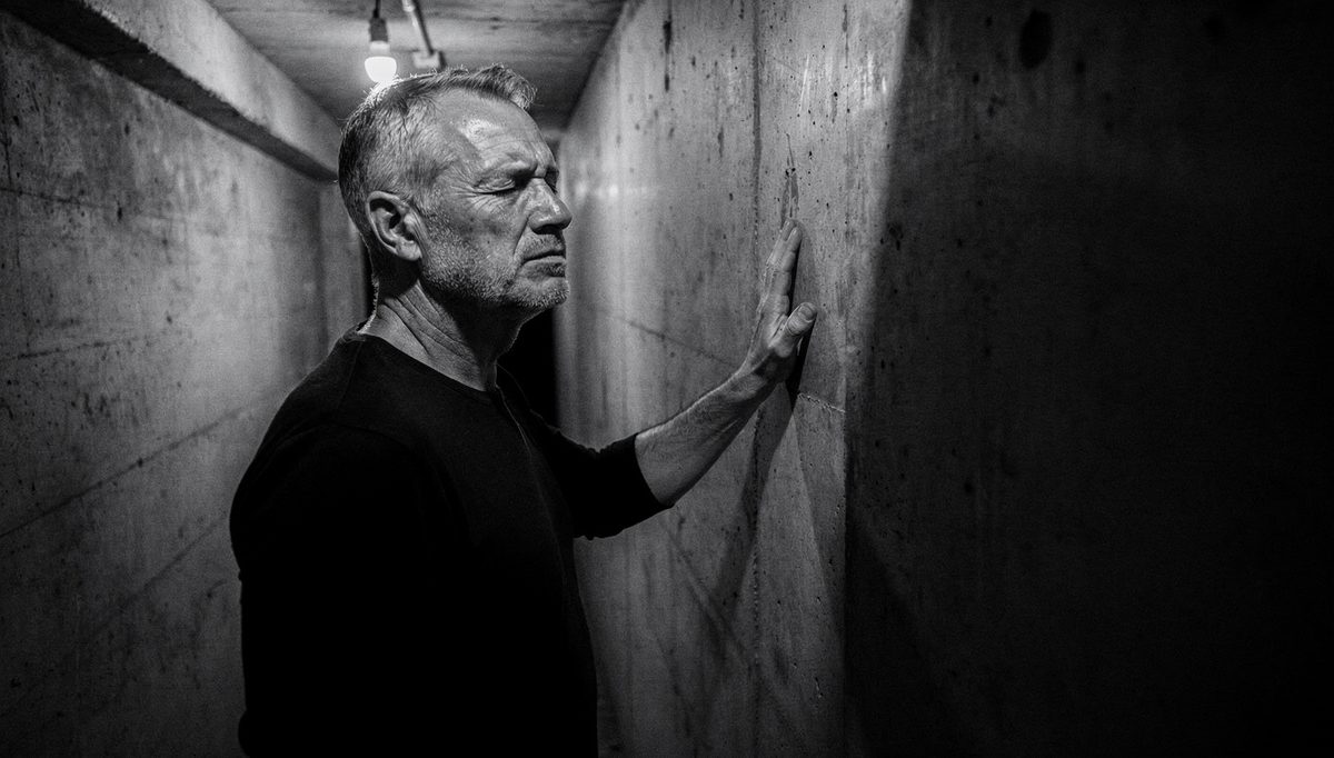 Man in corridor using mental preparation for physical readiness