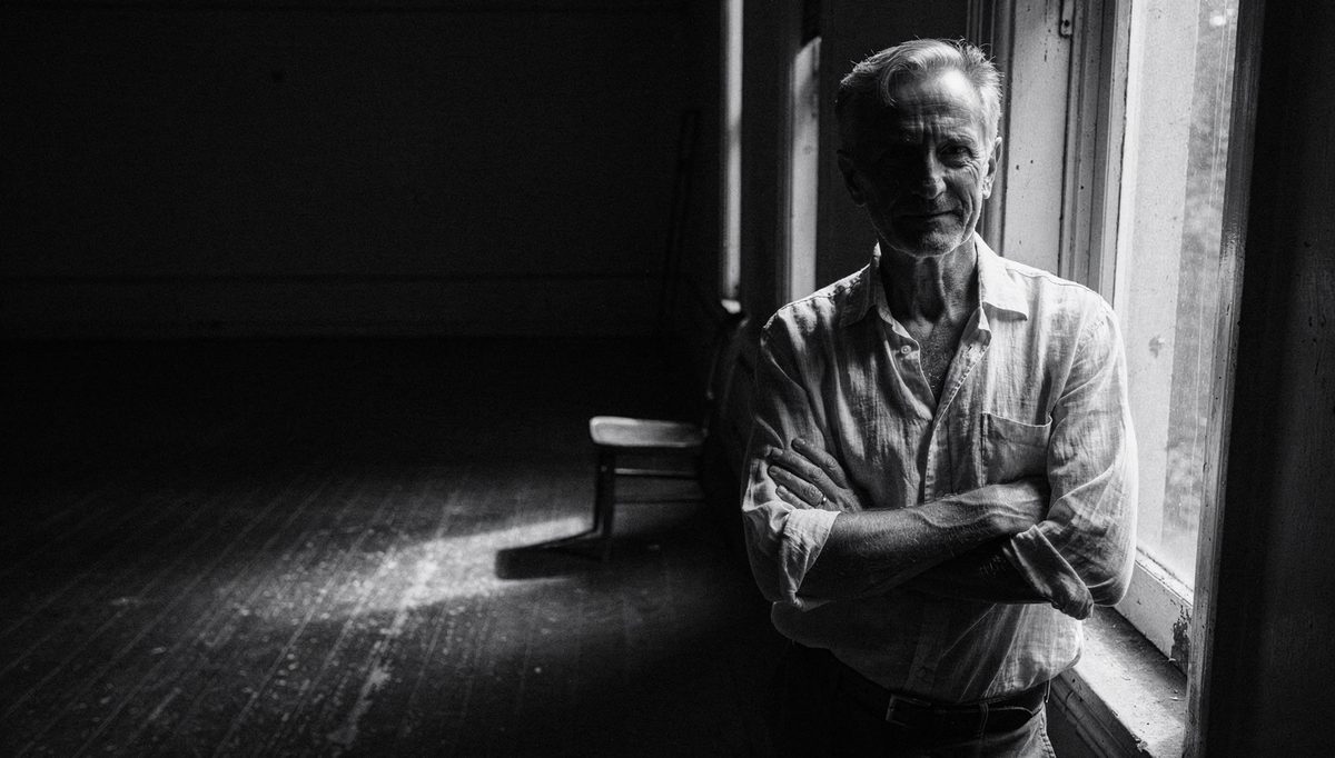 Man at window demonstrating nonverbal consistency aligning posture and gaze